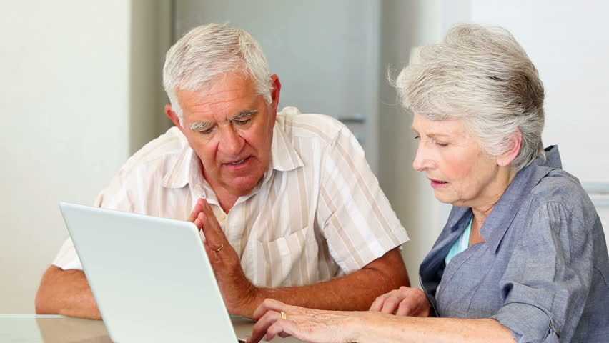 Senior Couple Examining Life Insurance Options