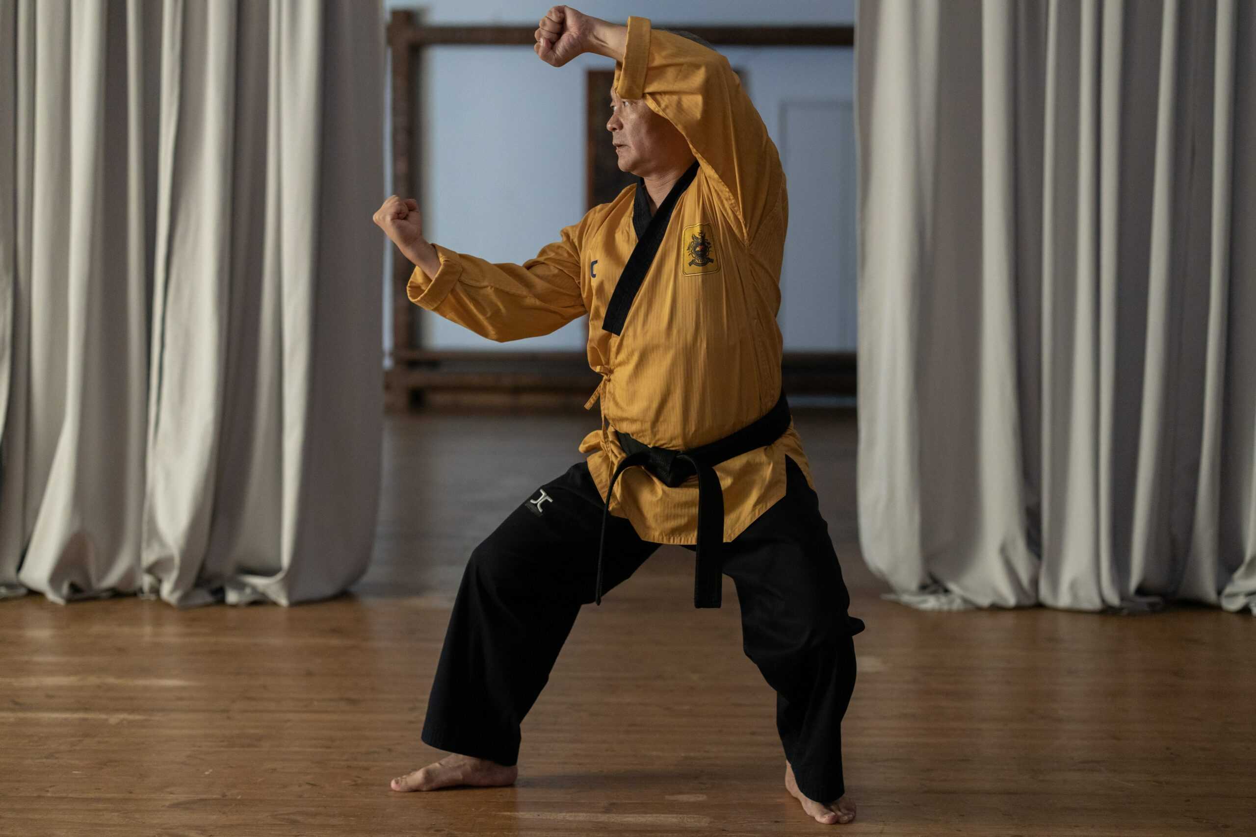 senior man doing martial arts