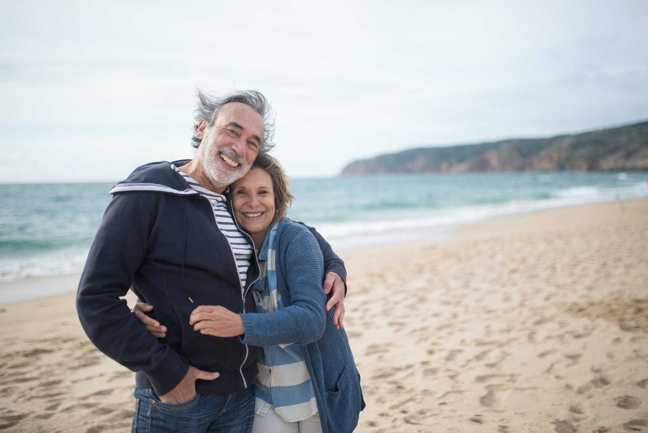 Senior couple hugging on the beach