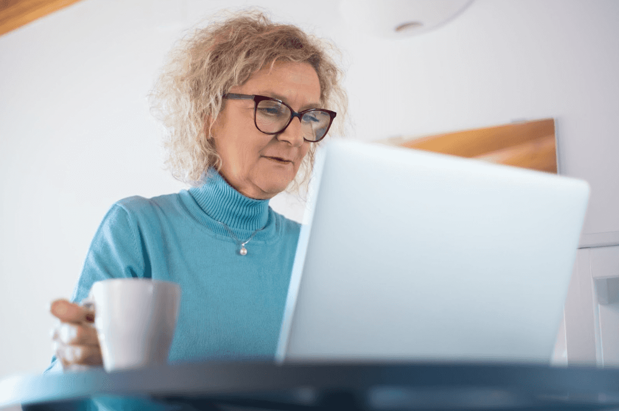 senior woman looking at a computer